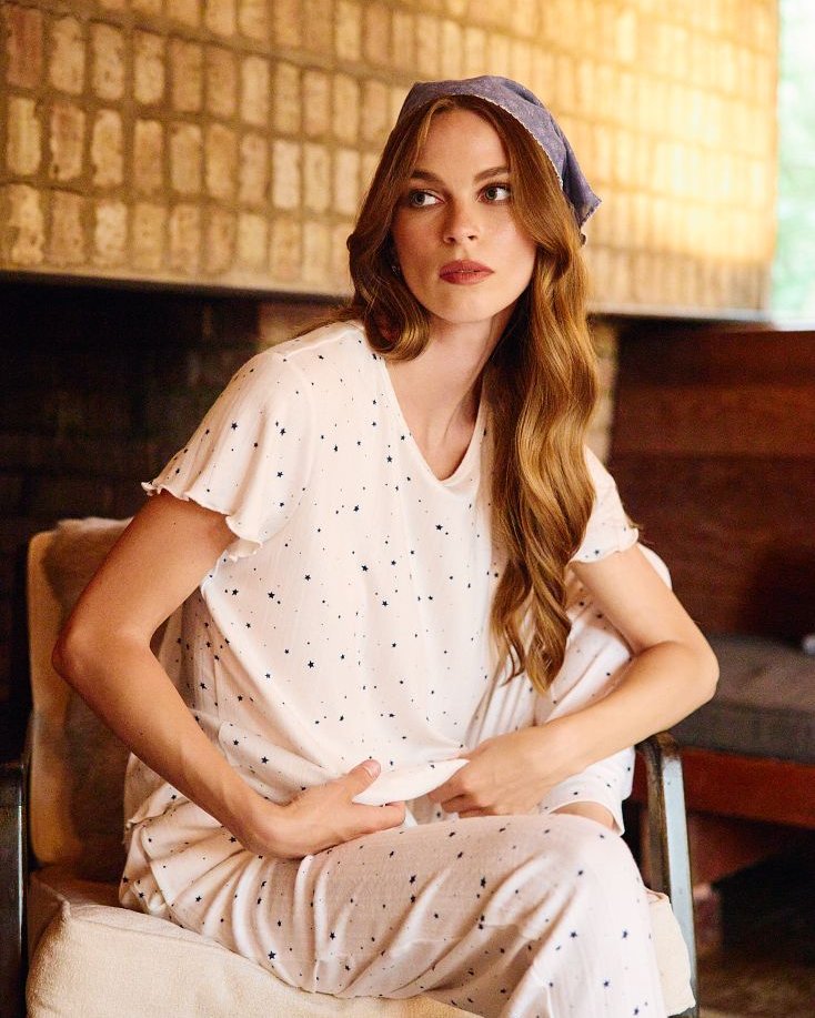 Model in the SEAS Doze cozy knit set, with the top styled as a wear-out separate