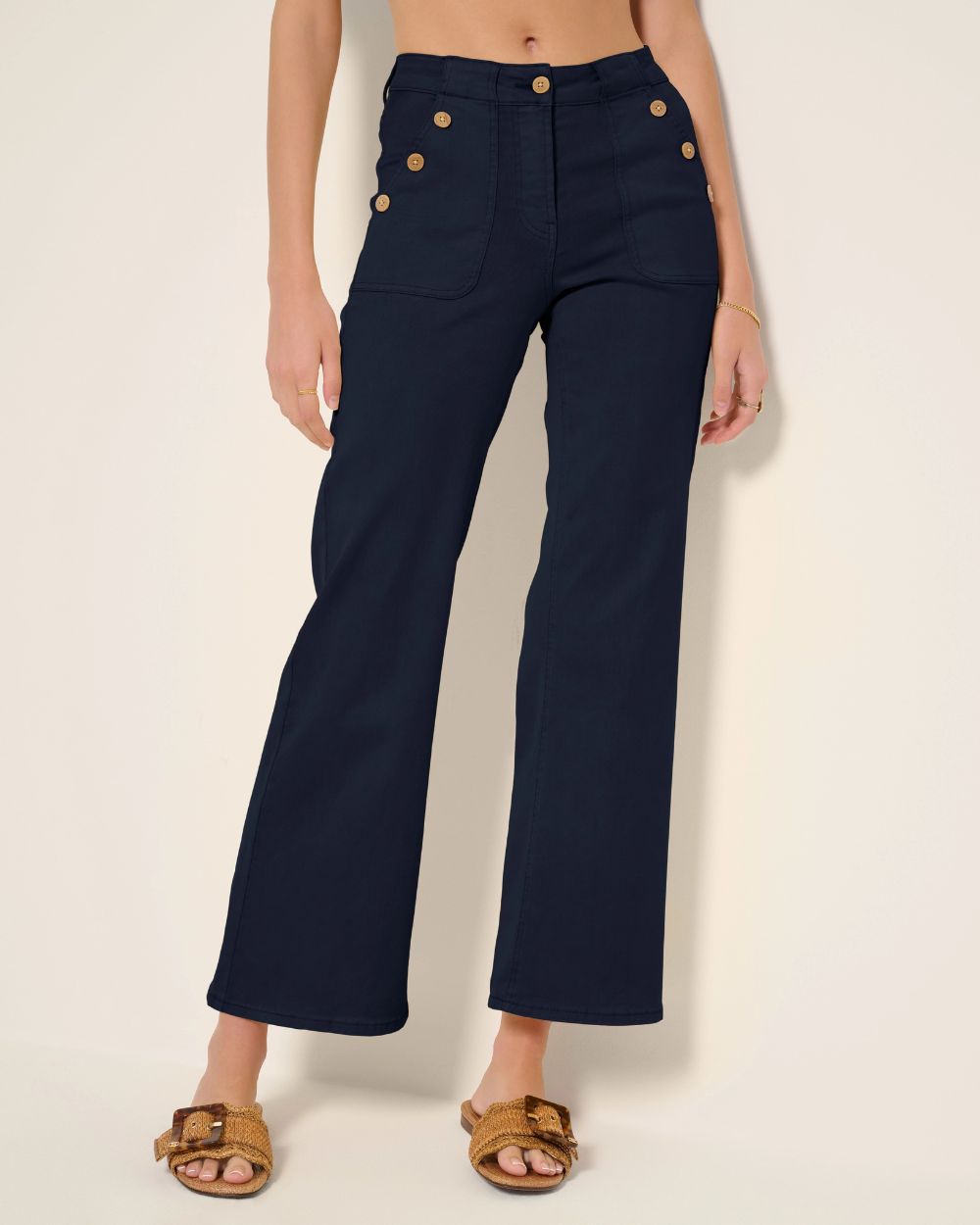 A silhouette shot of a pair of light-wash wide-leg jeans.