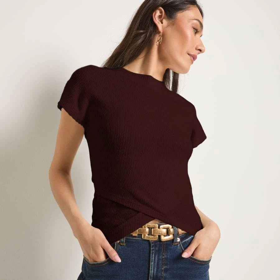 Blonde wearing a loose, red, off-shoulder sweatshirt.