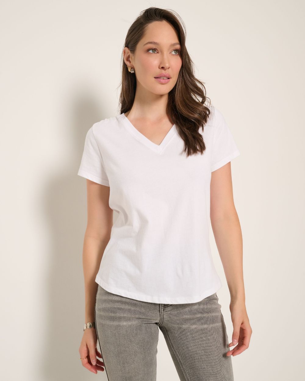 Brunette wearing a green cap sleeve t-shirt.