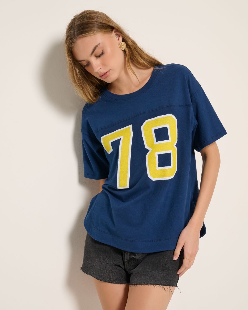 Blonde wearing a graphic hoodie that says "Sunday Funday".